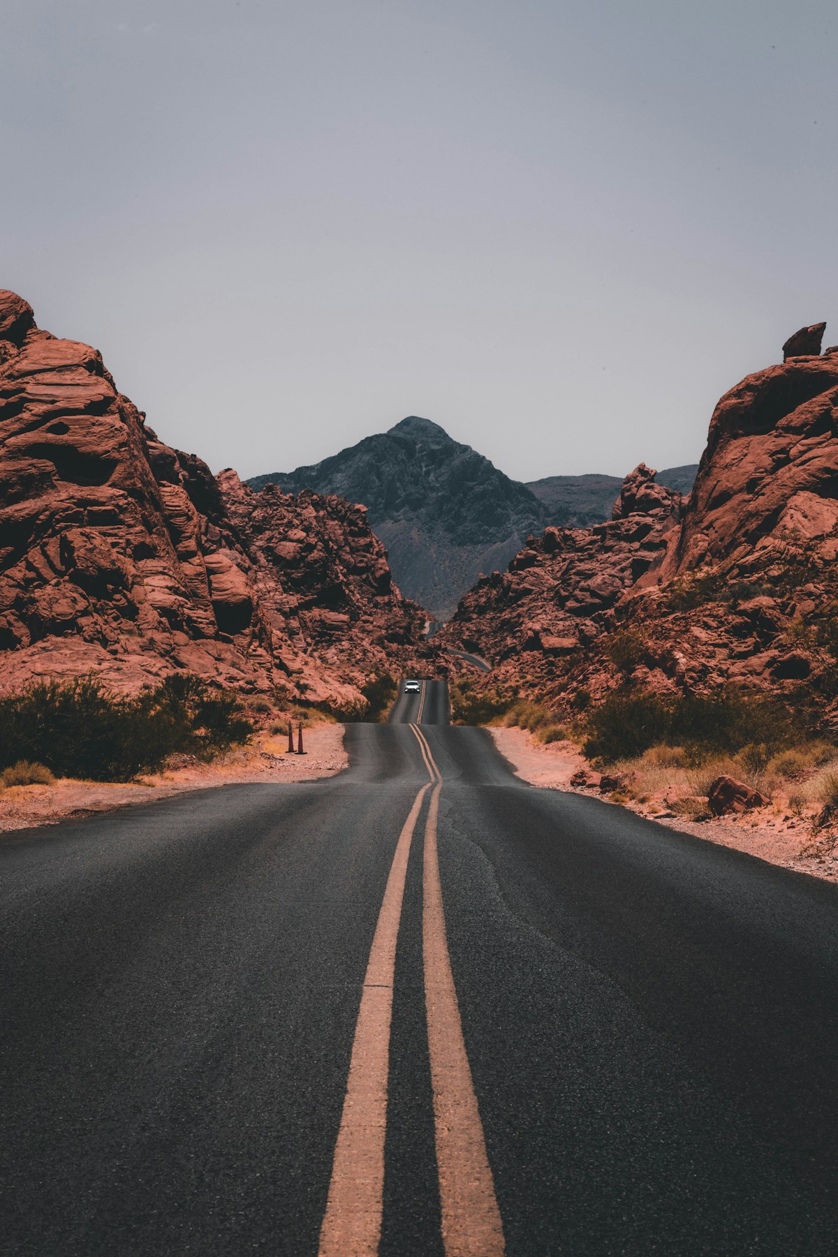 Open desert road beneath a blue sky