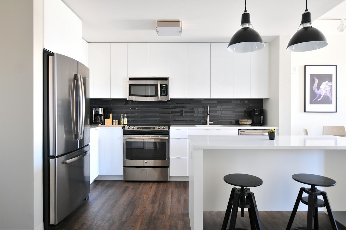 Kitchen with white cabinets and open counter space