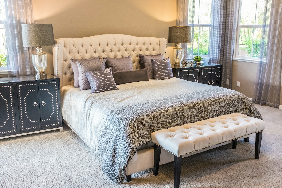 Bedroom with bedside lamps and soft furnishings